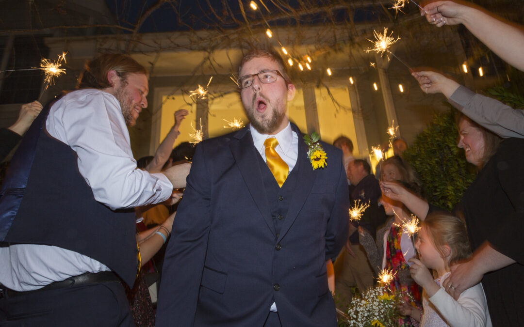groom dances during reception at wedding