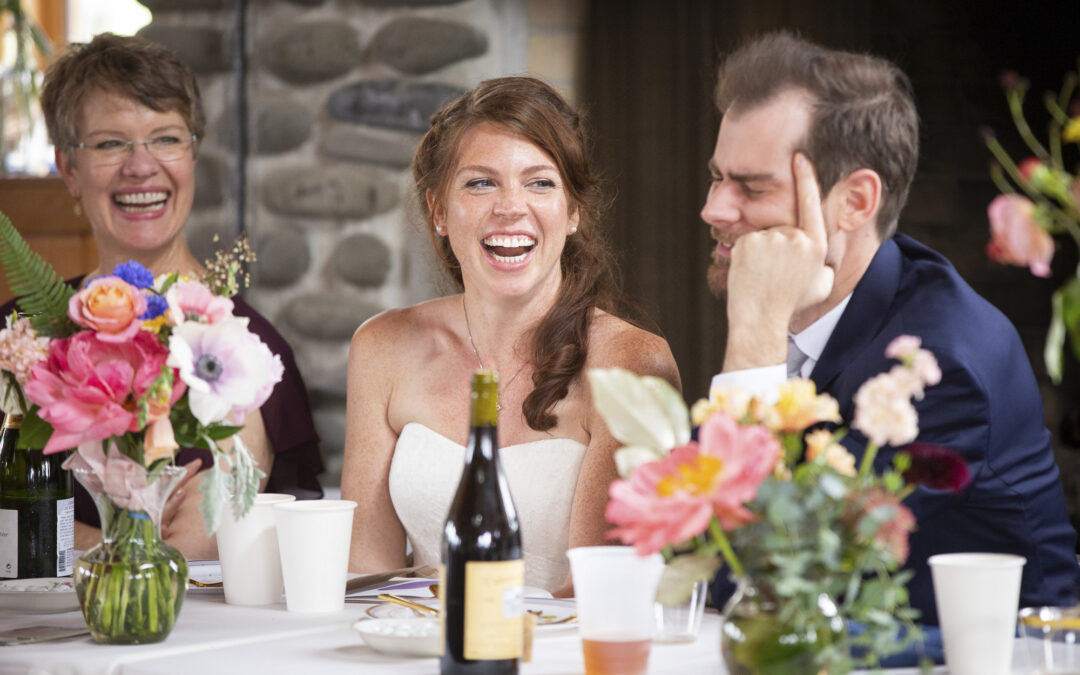 bride laughs at wedding reception