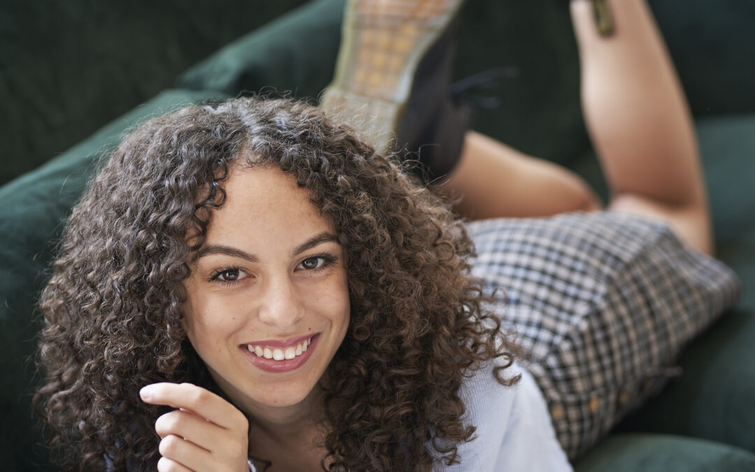 senior portrait of smiling mixed-race teenage woman