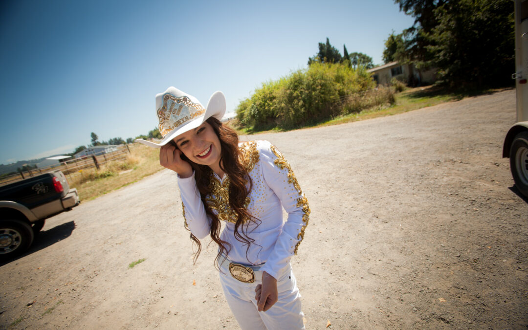young woman in fancy cowgirl outfit