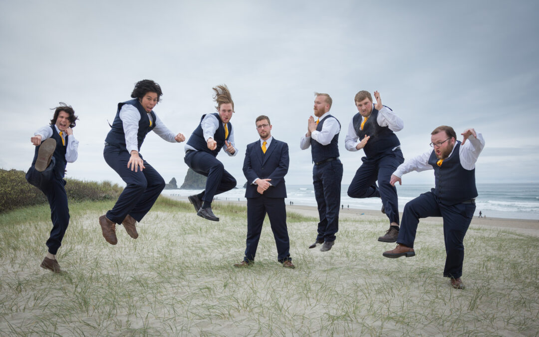 groom on beach surrounded by groomsmen jumping