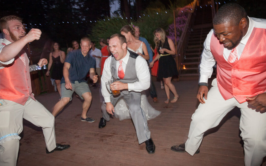 men at wedding reception dancing real funky