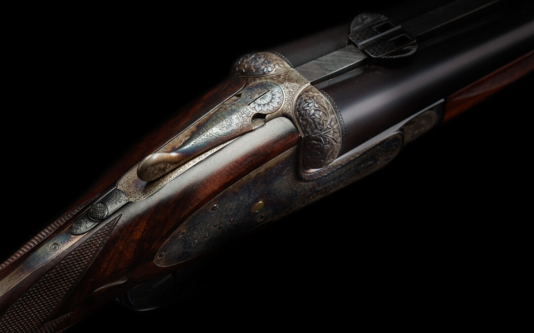 ornately engraved double barreled shotgun