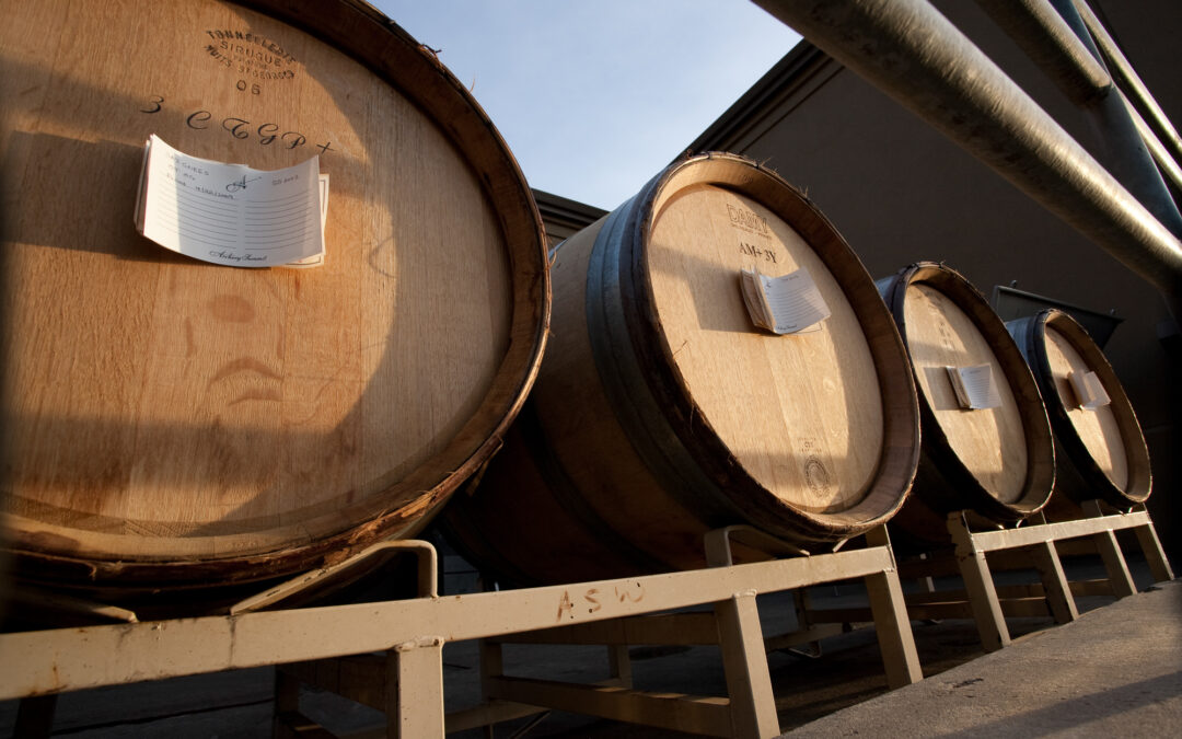 wine barrels against blue sky