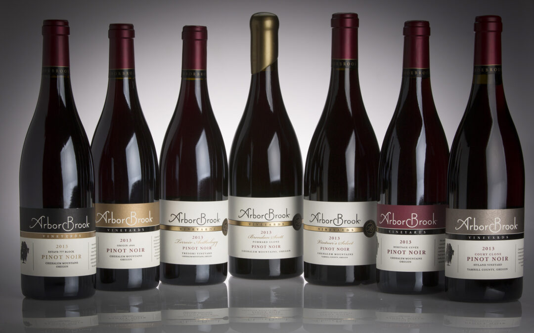 group of wine bottles against gradiated background
