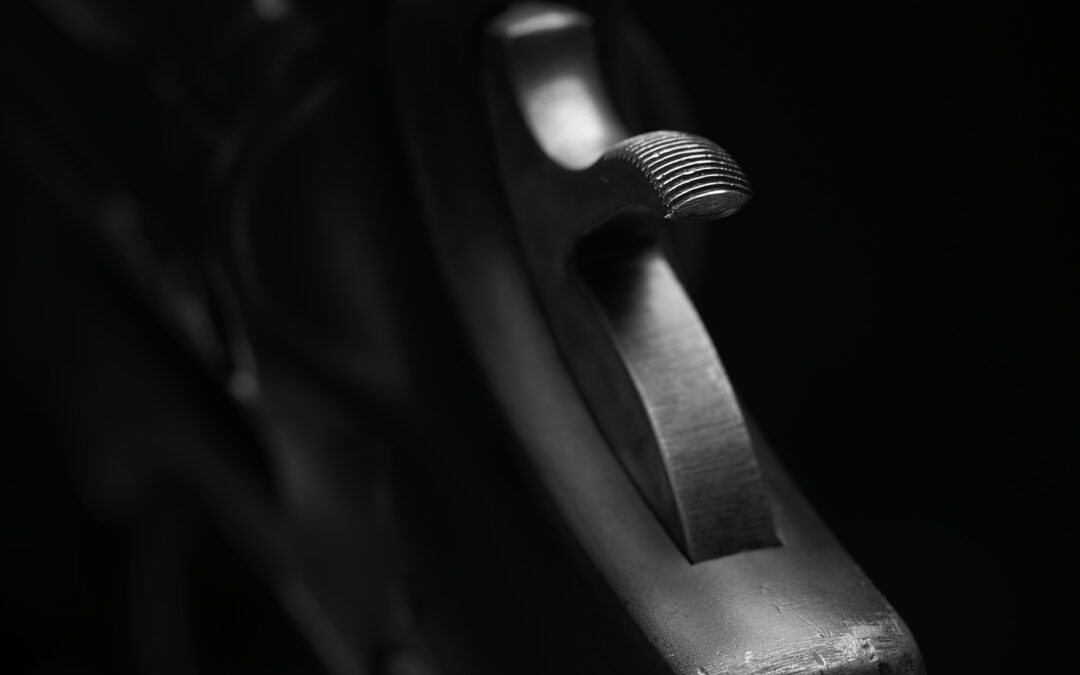 black and white close up of a High Standard Sentinel .22 revolver trigger