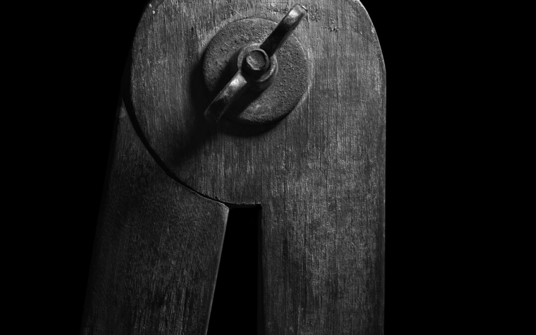 dramatic photo of the hinge on an artist's compass
